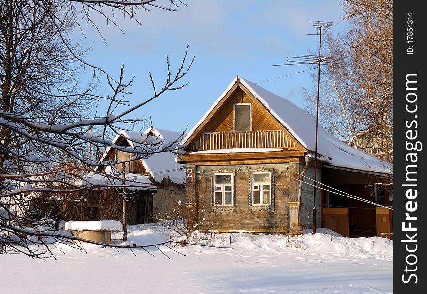 Wooden country house in Russia. Winter Landscape