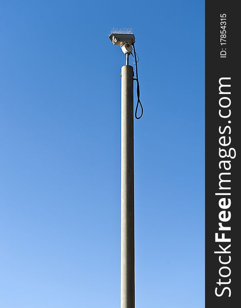 Security Camera CCTV against a blue sky