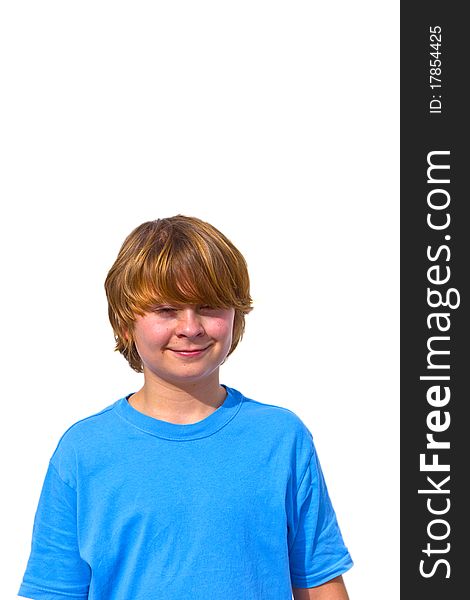 Portrait of cute young boy in sunlight with white wall