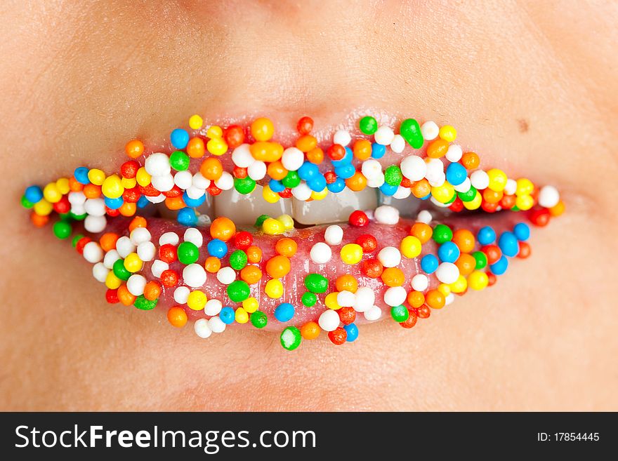 Beautiful lips with lots of sweet candy balls