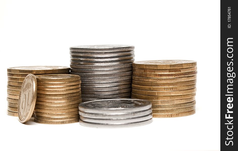 Coins stacked in a pile on a white background stacked in a pile on a white background
