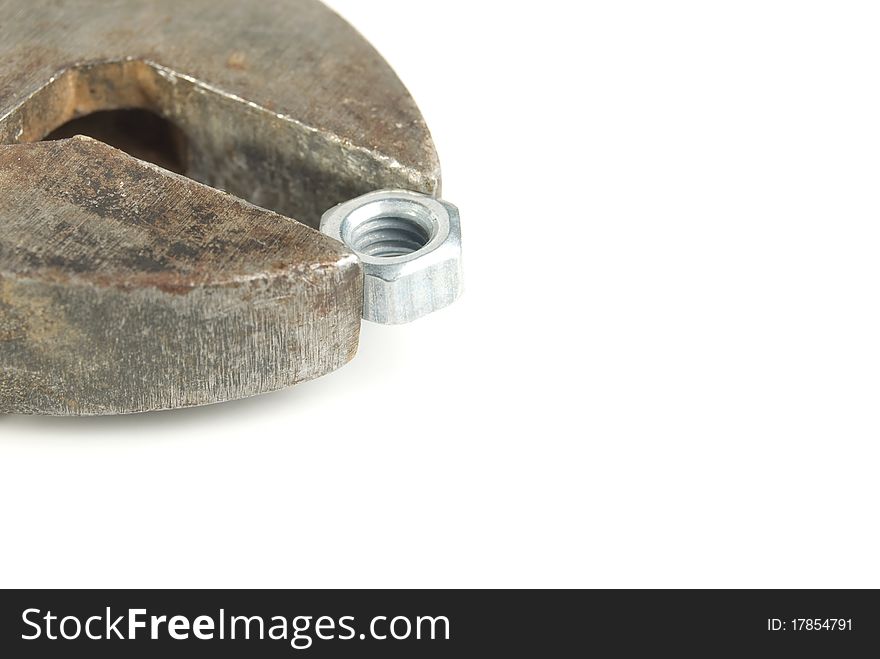 Adjustable spanner with a nut, is isolated on a white background