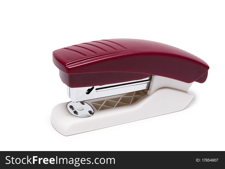 Stapler in red on a white background isolated. Stapler in red on a white background isolated