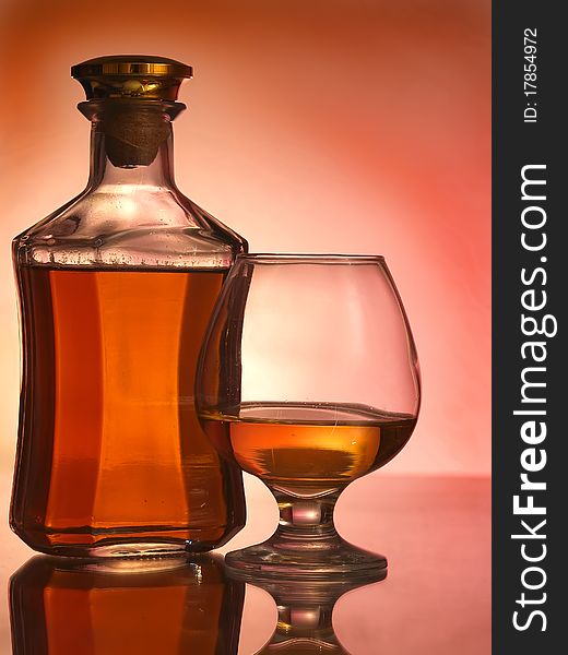 Cognac glass and bottle