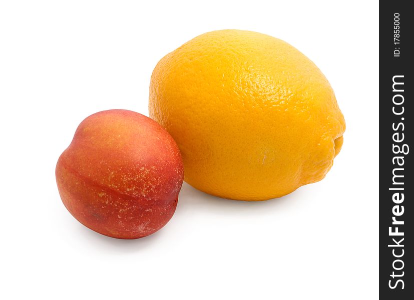 Citrus (lemon) and peach on a white background. Citrus (lemon) and peach on a white background