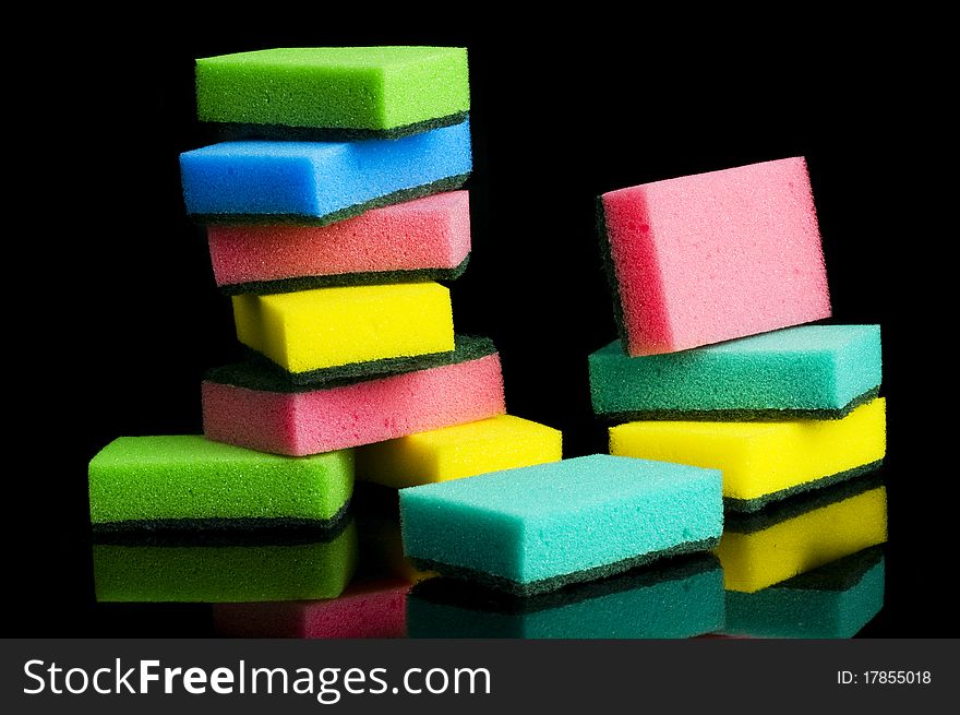 Multicolor kitchen sponge on black background