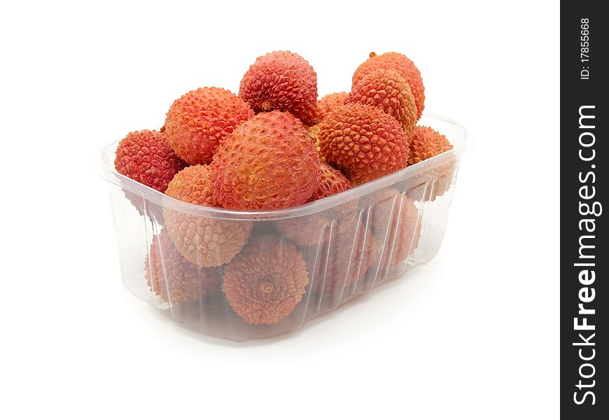 Litchi in the plastic box, isolated on white background.