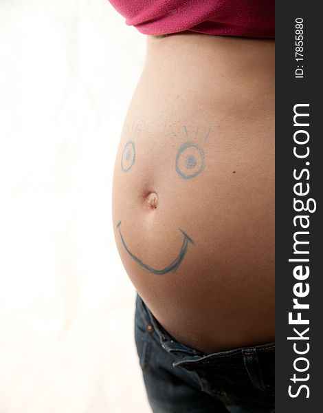 Pregnant abdomen with smile