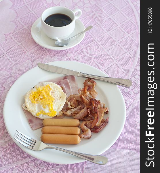 Breakfast Include ham, sausage, fried egg, coffee.