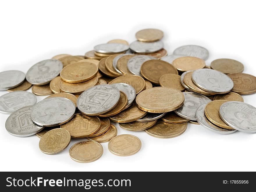 Coins from the yellow metal on a white background