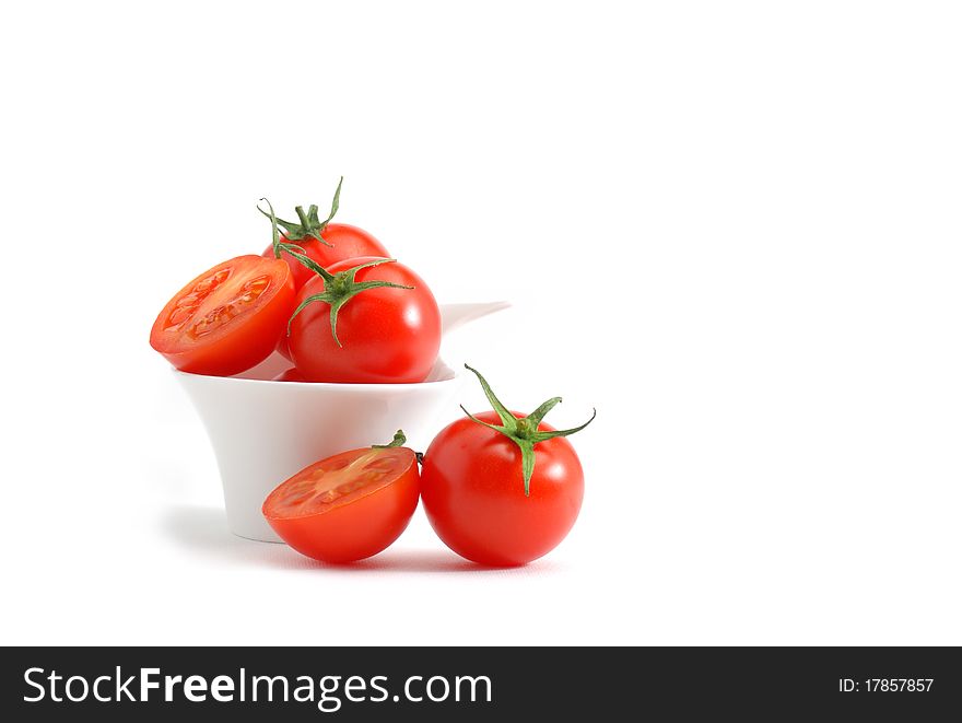 Cherry tomatoes isolated over a white background