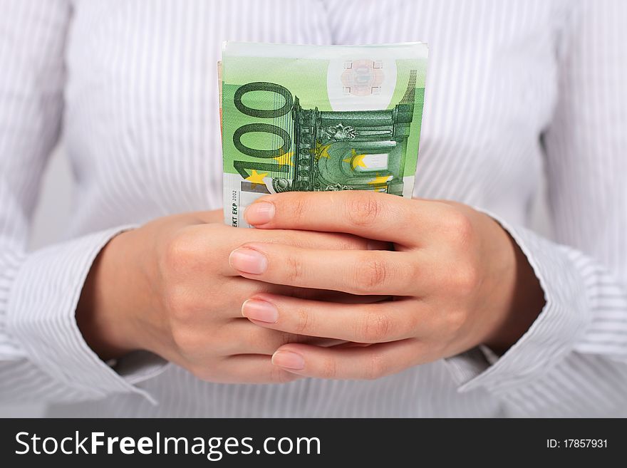 Financial concept. Businesswoman with euro money in hands.