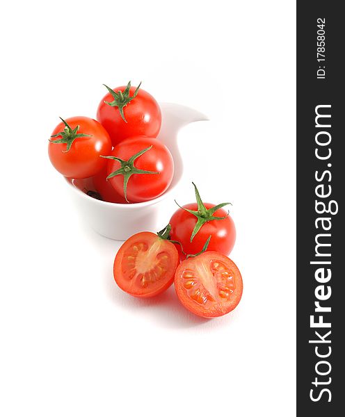 Cherry tomatoes isolated over a white background