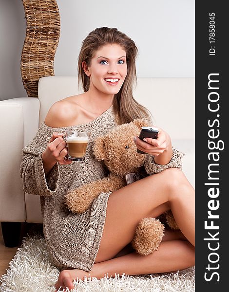 Beauty, young girl holding a cup of coffee