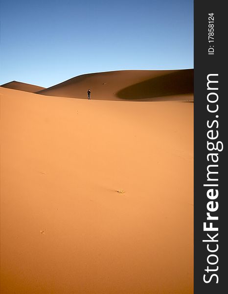 People at the dunes of the Moroccan Sahara. People at the dunes of the Moroccan Sahara