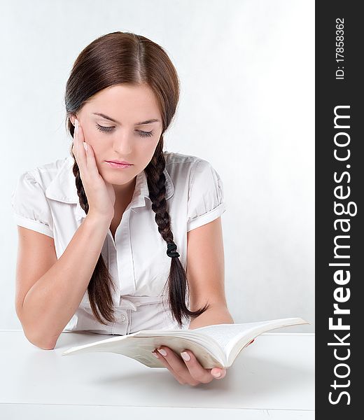 Girl reading a book brunette