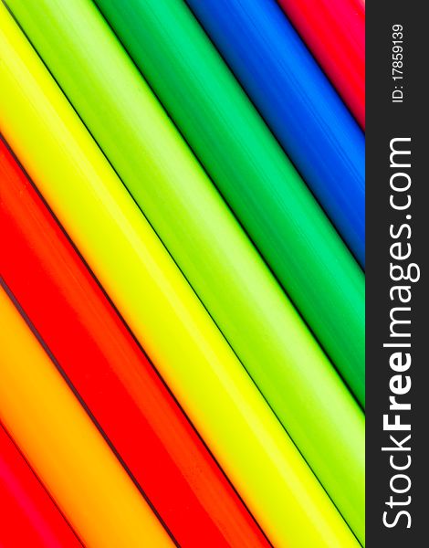 Extreme colors, ultra-bright multi colored pencils isolated on white close-up
