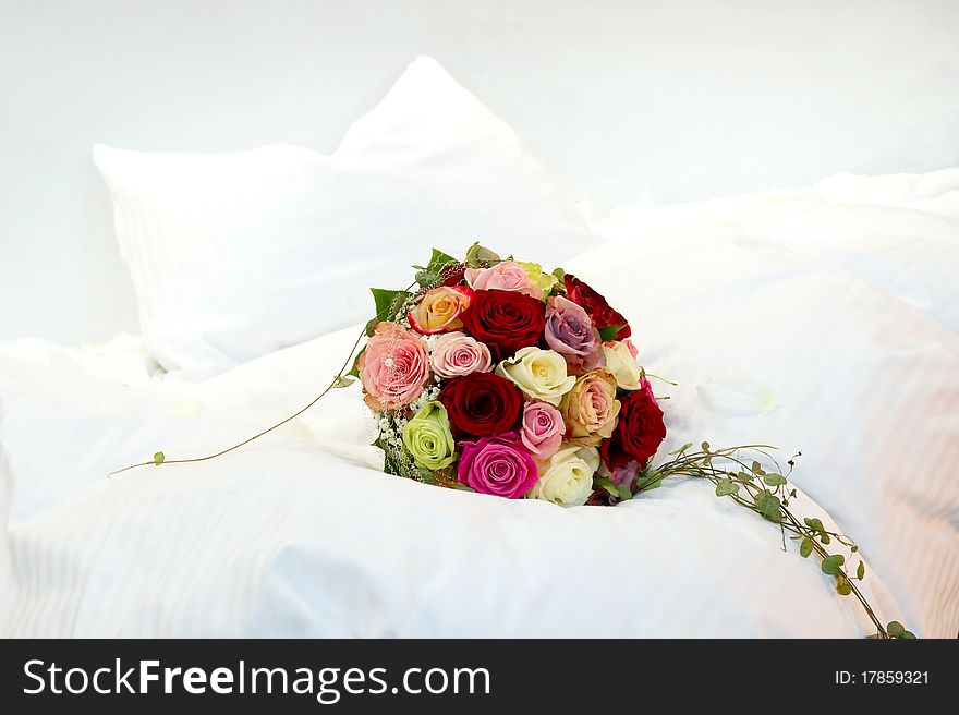A Bridal Bouquet on a bed