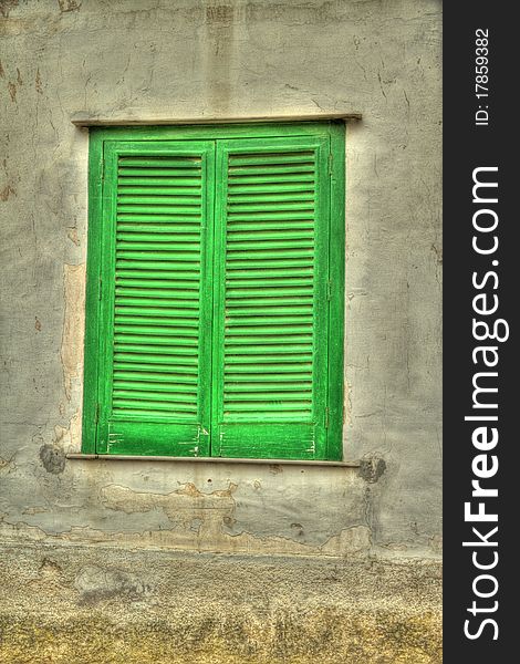 Green shutters on a house on the island of Capri. Green shutters on a house on the island of Capri.