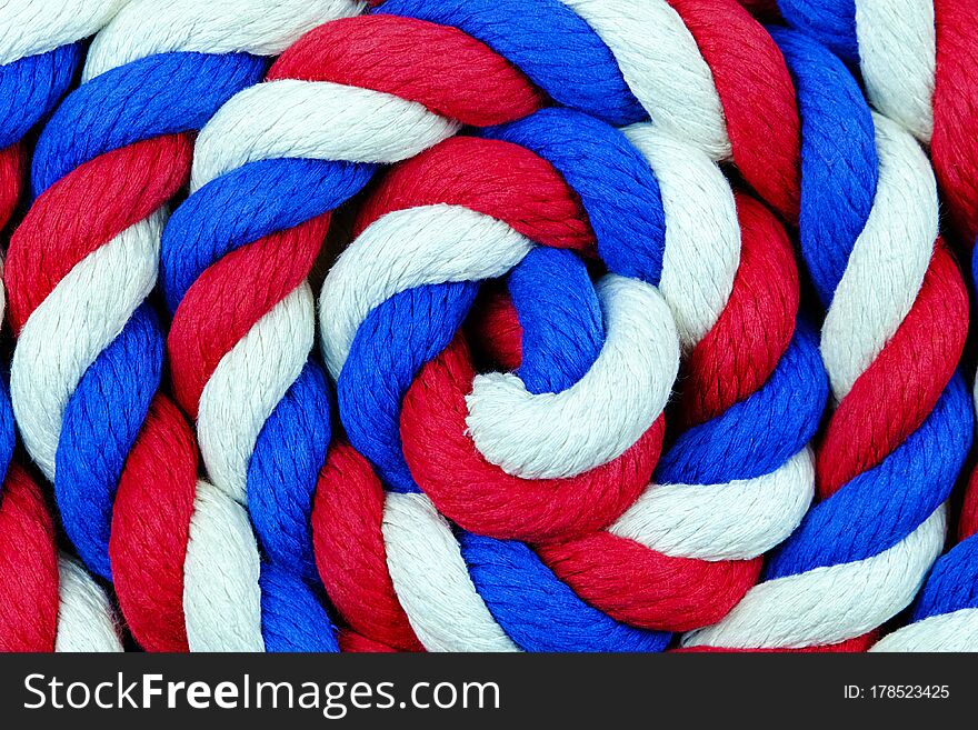 Bright zventone rope twisted in a circle on the plane. background