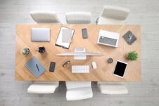 Modern Office Table With Devices And Chairs Stock Image