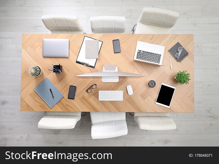 Modern Office Table With Devices And Chairs