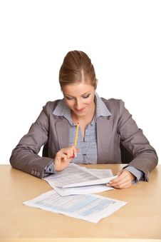 Woman In Suit Sitting At The Desk Stock Photo