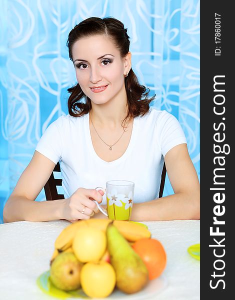 Young woman is having a breakfast at home.