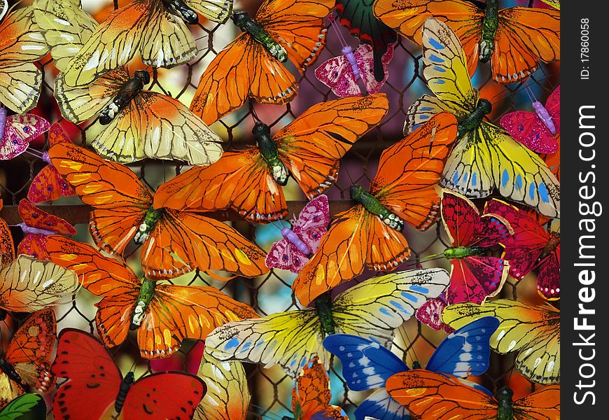 Mutliple colorful butterflies create natural-themed background. Mutliple colorful butterflies create natural-themed background