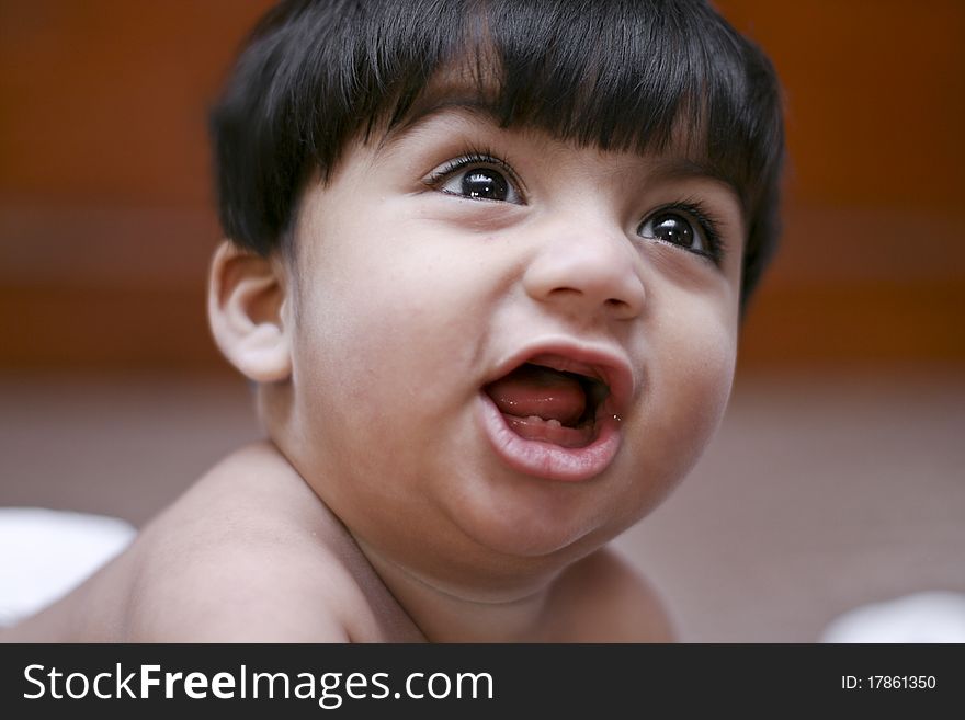 Small child in hyper mood, with a shallow depth of field.