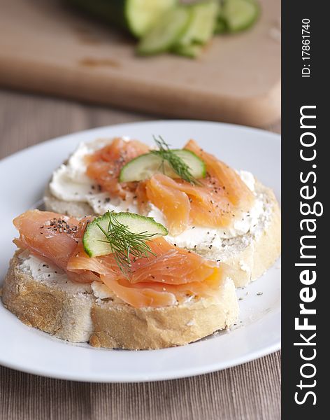 Toasted bread with cheese spread and smoked salmon. Toasted bread with cheese spread and smoked salmon