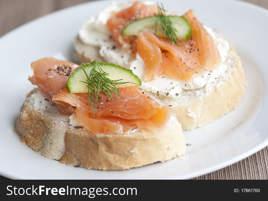 Toasted bread with cheese spread and smoked salmon. Toasted bread with cheese spread and smoked salmon