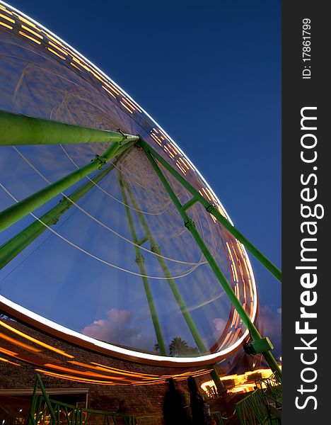 Ferris wheel turning around  in an amusement park