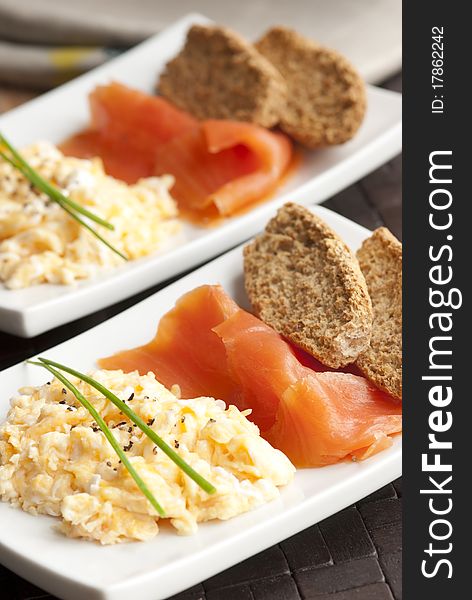 Smoked salmon with scrambled egg and crisp bread. Smoked salmon with scrambled egg and crisp bread