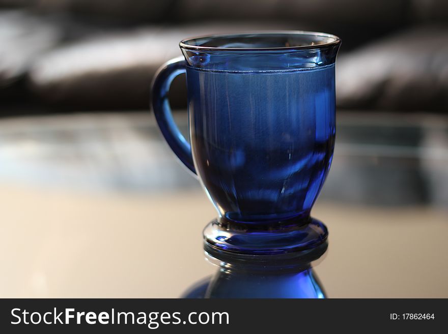 A full bright blue mug. A full bright blue mug