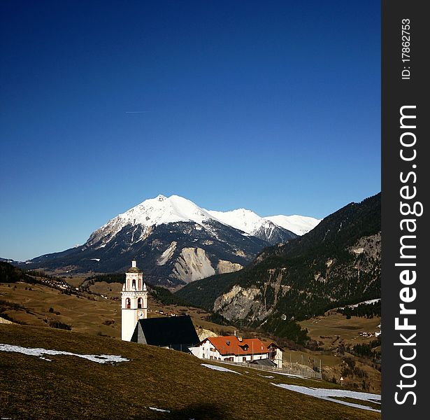 Parsonz, a small village with a church in the mountains of the Swiss Alps is located in the Graubuenden Kanton. Parsonz, a small village with a church in the mountains of the Swiss Alps is located in the Graubuenden Kanton.
