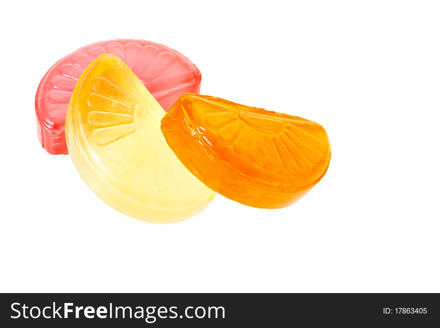 Fruit drop lemon, orange and grapefruit sections isolated on white