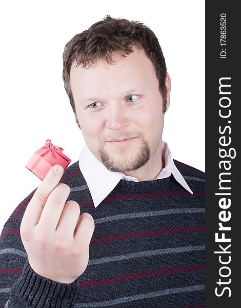 Young man holding valentine gift in his hand