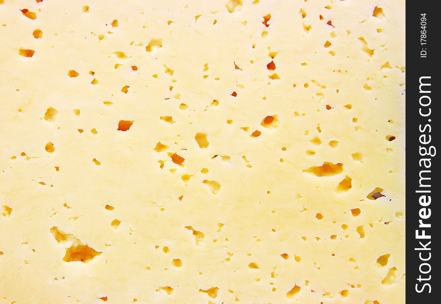 Background of fresh yellow Swiss cheese with holes. Background of fresh yellow Swiss cheese with holes