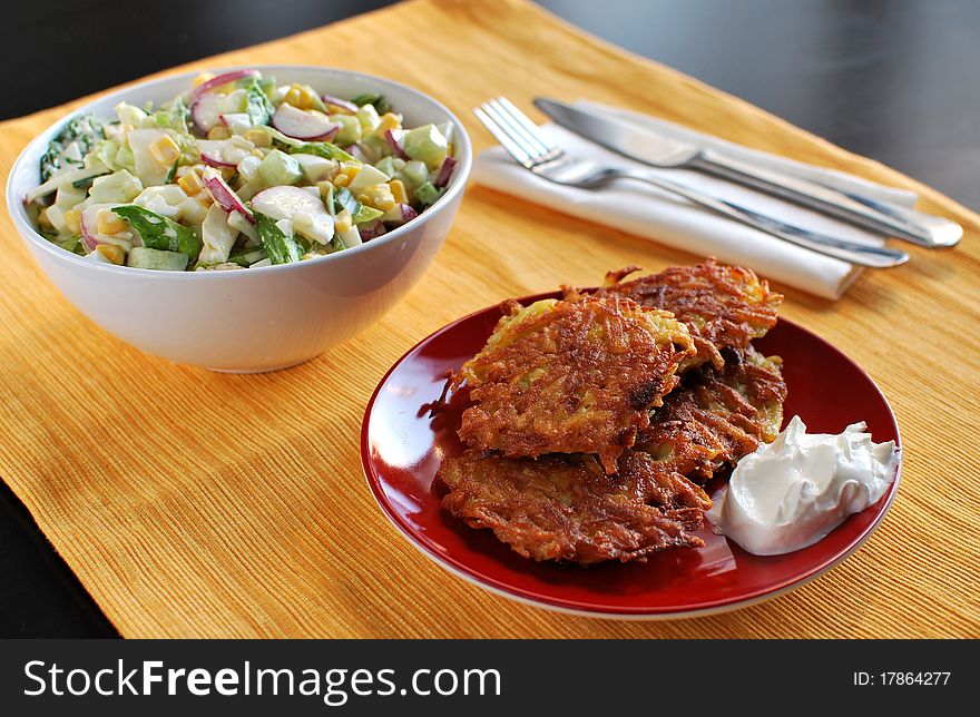 Salad and fried potato breakfast. Salad and fried potato breakfast