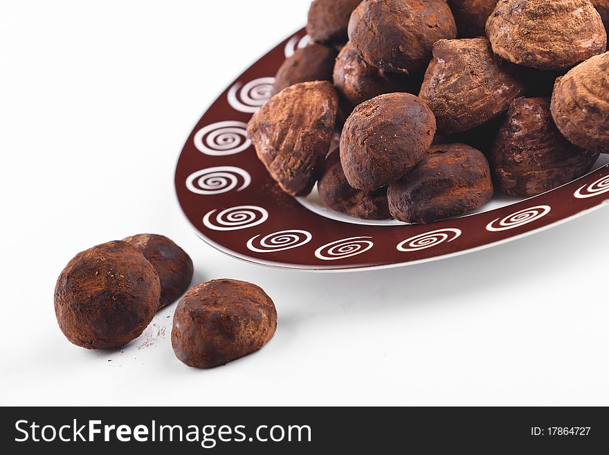 Chocolate truffles for dessert plate on the white background