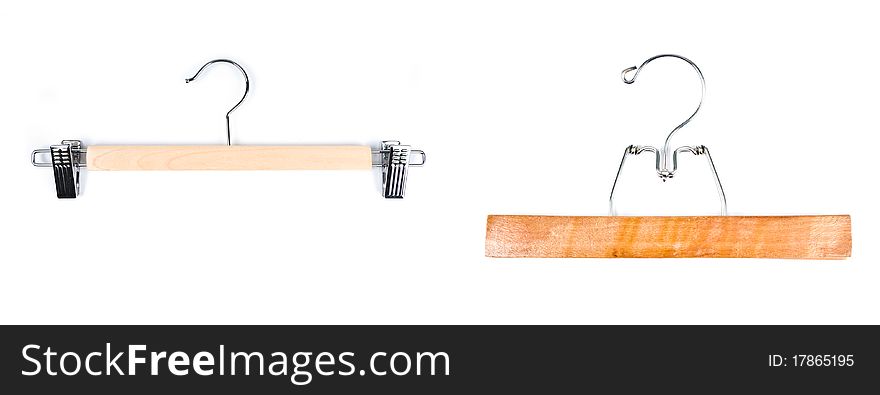 Two wooden pants/skirts hangers isolated on white.