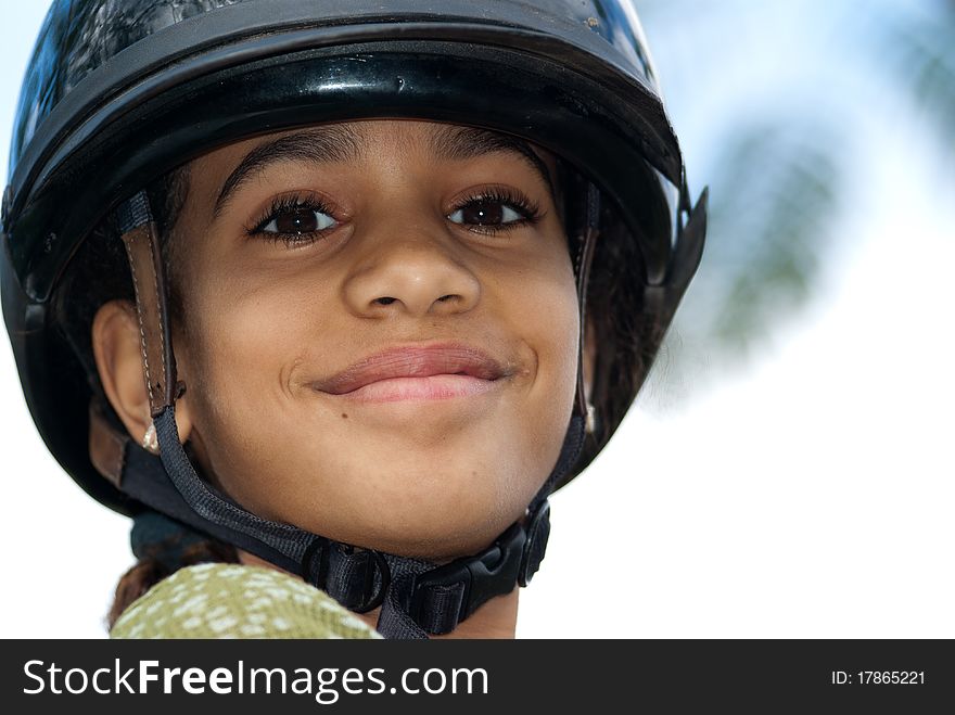 Young, happy, confident girl at the beginning of a day riding horses with her family. Young, happy, confident girl at the beginning of a day riding horses with her family.