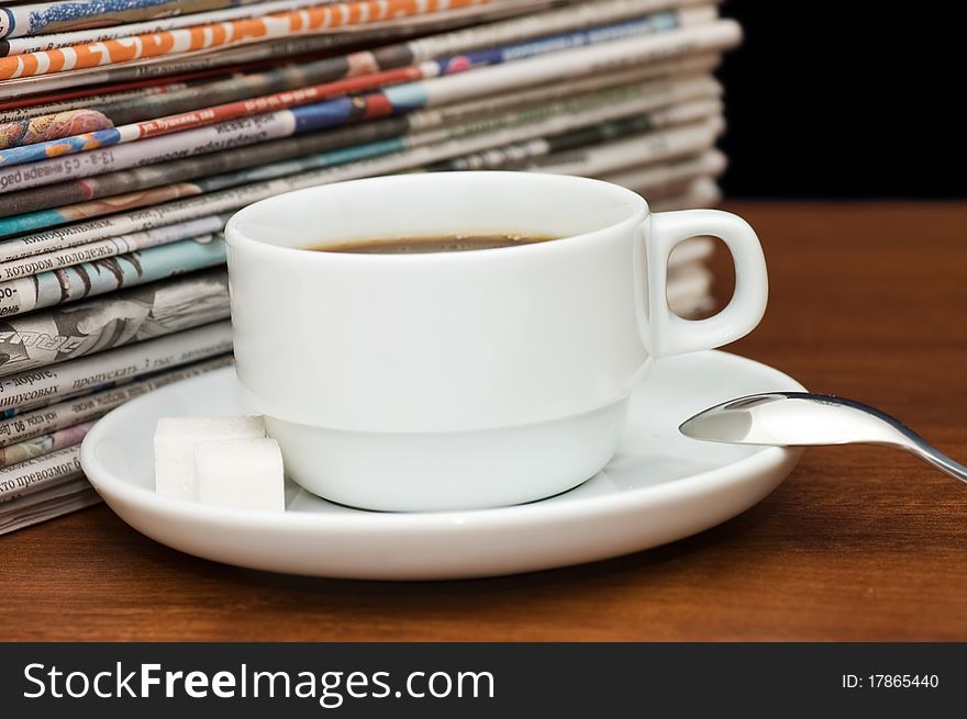 Cup from coffee and the newspaper still life