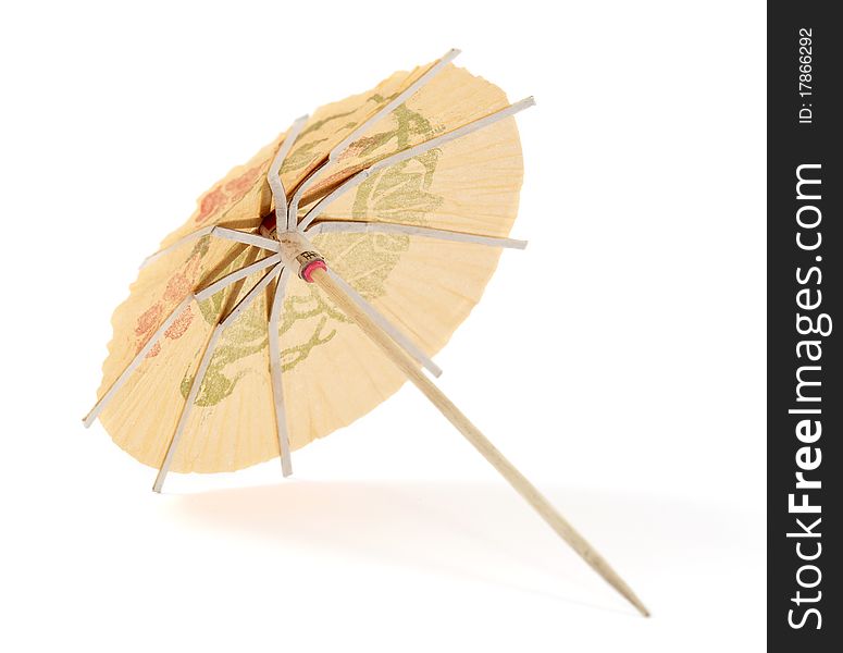 Umbrella for cocktails on a white background