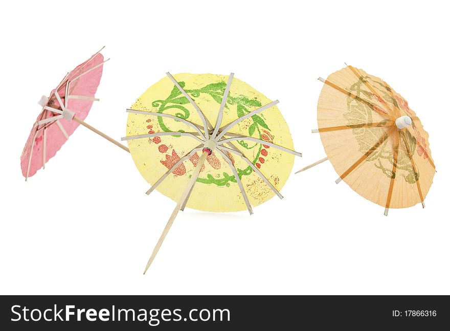 Umbrellas for cocktails on a white background