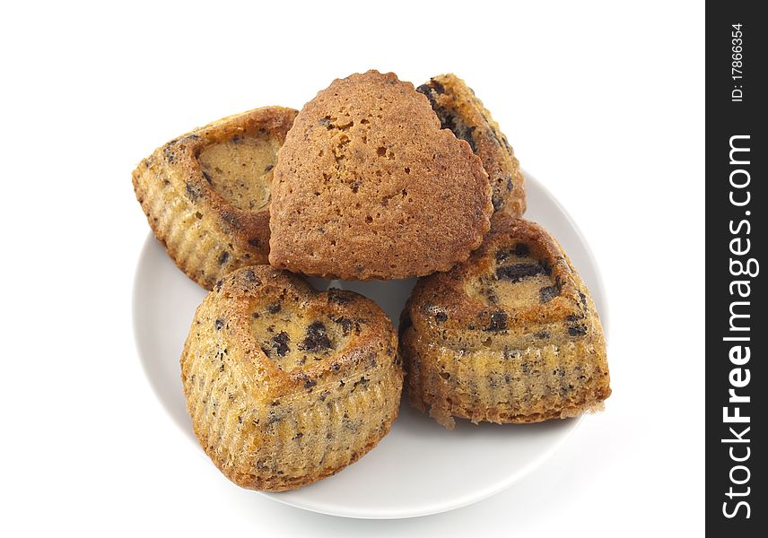 Muffins with chocolate in a heart on a white background