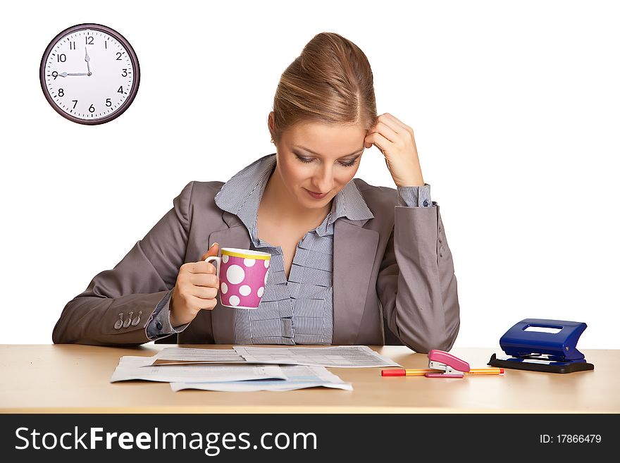 Woman in suit sitting at the desk isolated on white