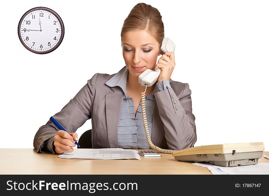 Businesswoman in suit talking on the phone isolated on white