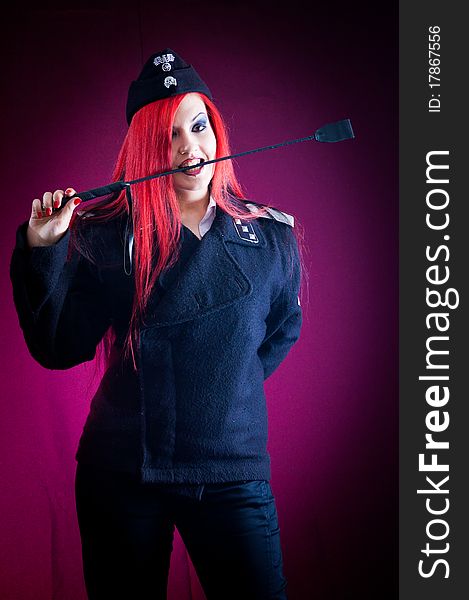 Female dressed in uniform in studio with red hair. Female dressed in uniform in studio with red hair